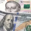 Купюри номіналом: 100 доларів і 500 гривень